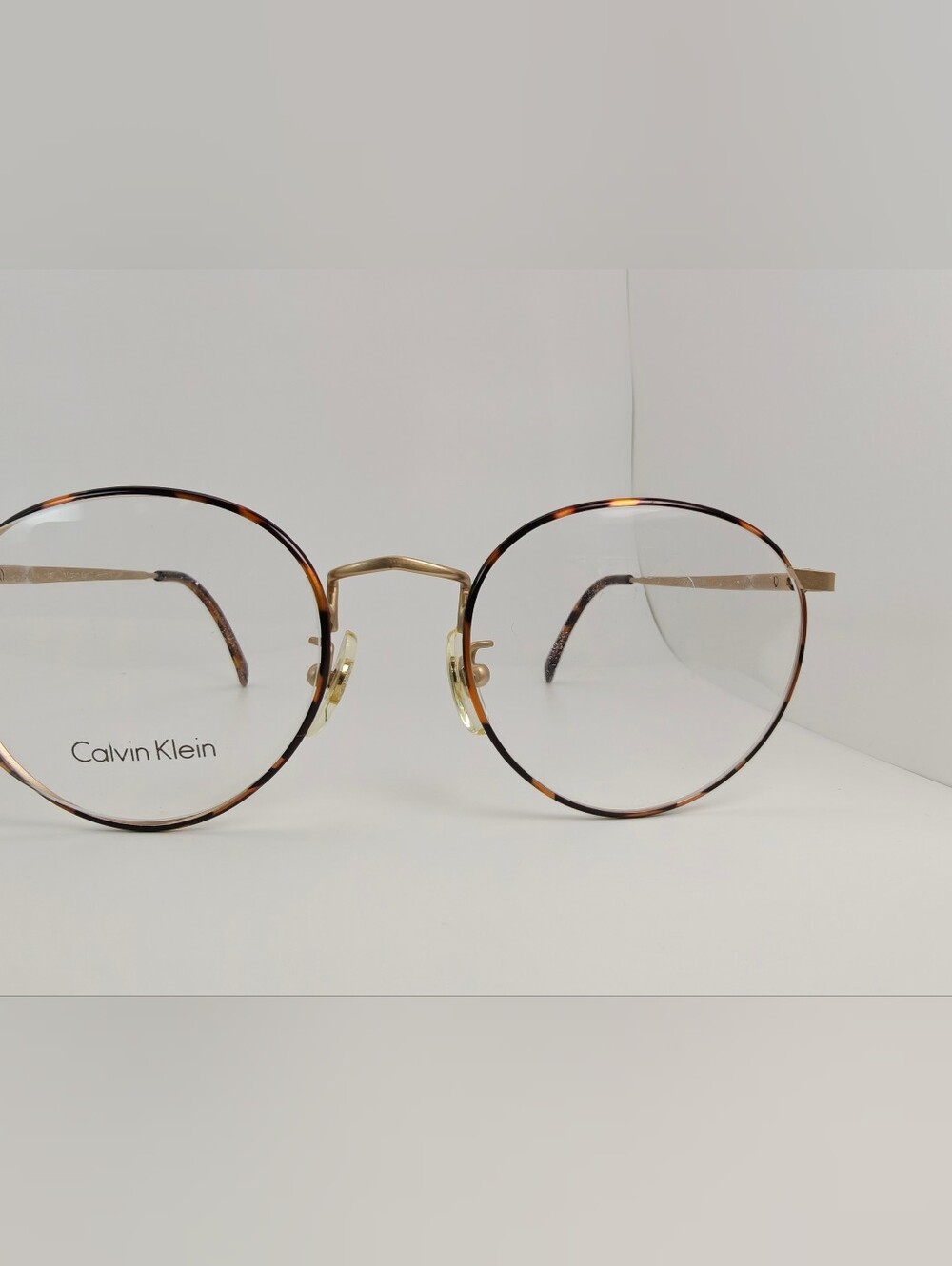 Calvin Klein CK 203. 140. Col 322Tortoiseshell Rim with Gold Metal Round Frames.
